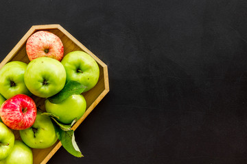 Healthy diet concept. Fresh apples in tray on black background top view copy space