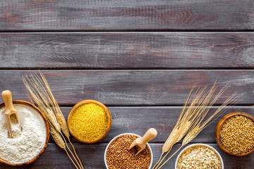 Cereals collection on dark wooden background top view frame copy space