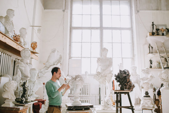 Sculptor creates in workshop
