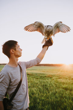 Young male with falcon on his hand