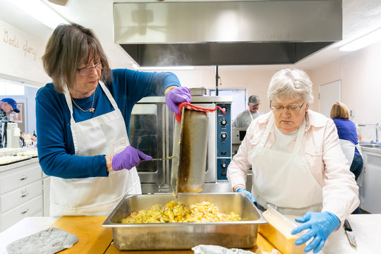 Volunteers Preparing a Community Meal