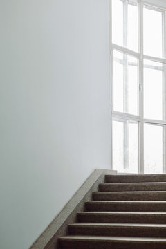Concrete steps with white wall