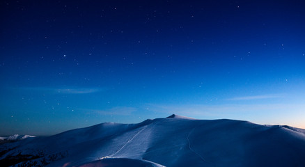 Fototapeta na wymiar Empty ski resort under the moonlight at night