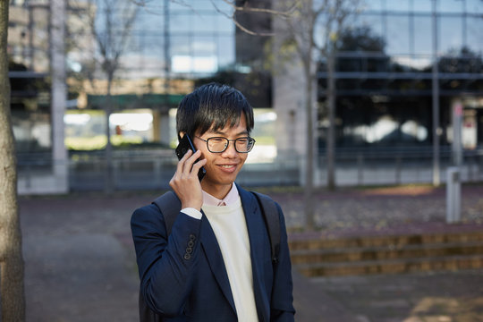 Young asian man speaking with the phone