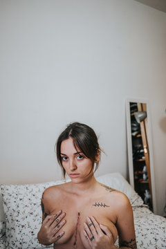 Woman showing her scar on her chest