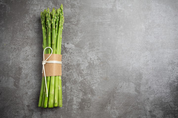 Fresh green asparagus on table.