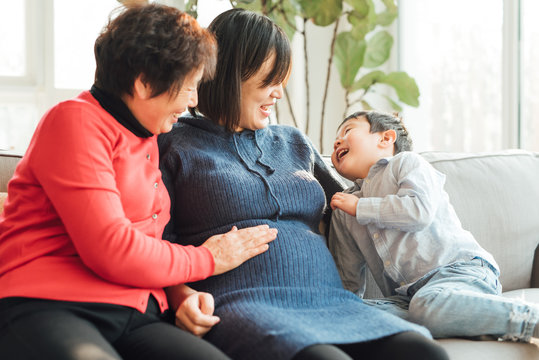 Grandmother, pregnant daughter and grandson at home