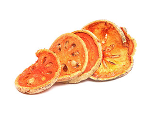 Dry bael fruit ( Aegle marmelos) slice isolated on white background with clipping path..