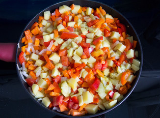 Steamed vegetables on frying pan 