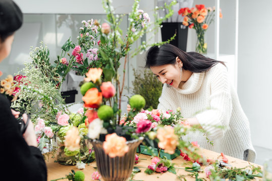 Young asian girls making flower arrangement