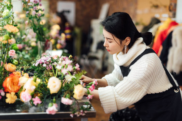 Young asian girls making flower arrangement