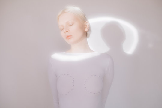 Young model standing in white room