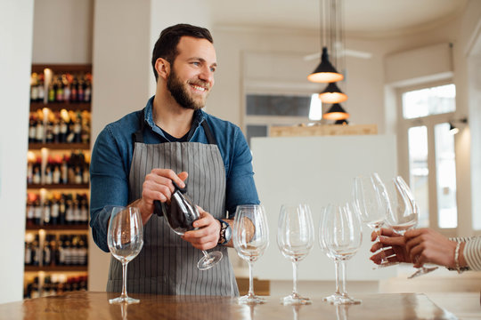 Smiling Man Working in a Bar
