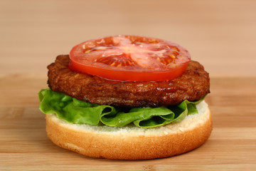 Put Tomato on Patty. Making Hamburger. Macro. Series.