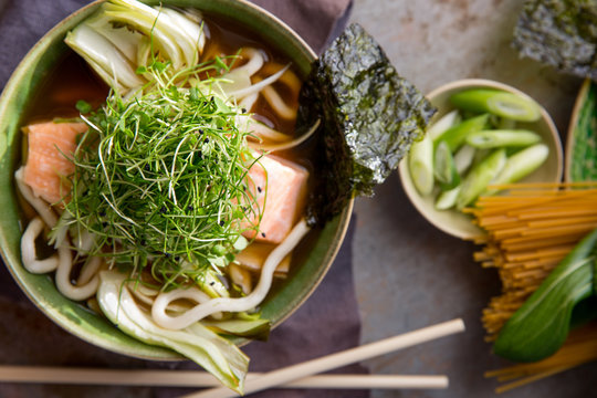 Miso broth with salmon, noodles and micro greens