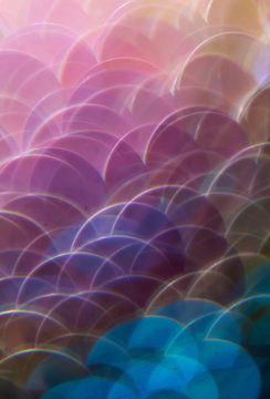 Mermaid scale paillettes photographed through a prism