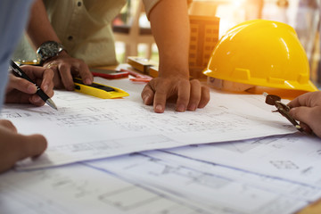 Engineering team consulting and analyzing the high-rise building projects in the city.Home Project to Offer Management