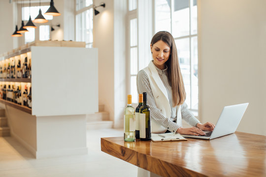 Businesswoman Working at Wine Shop