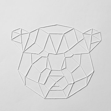 Embroidered pattern with white threads in the shape of a bear's