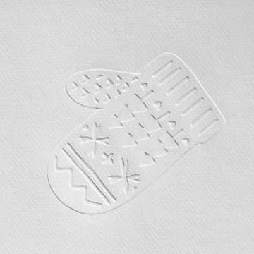 Gray cardboard with an embossed pattern in the form of a mitten