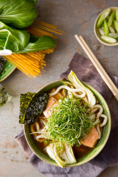 Miso broth with salmon, noodles and micro greens