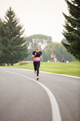 sport girl making exercises outdoors. Young sport woman in a park