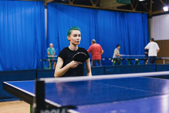 Woman in wheelchair playing table tennis