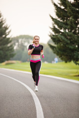 sport girl making exercises outdoors. Young sport woman in a park