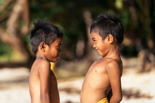 Asian boys looking at each other