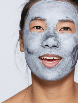 Fun skincare portrait asian woman looking up