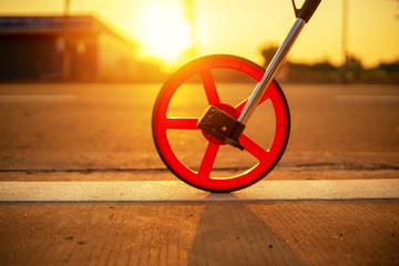 Sunset Distance measurement wheels on the road