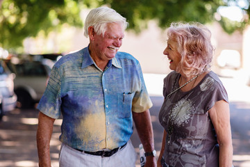 happy couple walking in the street