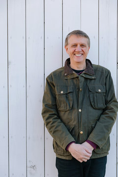 Pulled back portrait of a mature man in his sixties.