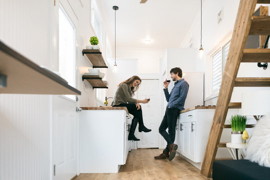 Home: Couple Relaxing And Talking In Tiny Kitchen