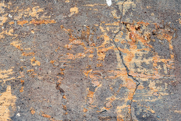 Texture of a concrete wall with cracks and scratches which can be used as a background