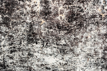 Texture of a concrete wall with cracks and scratches which can be used as a background