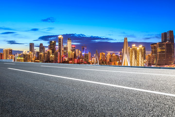 Empty asphalt road and Chongqing night cityscape