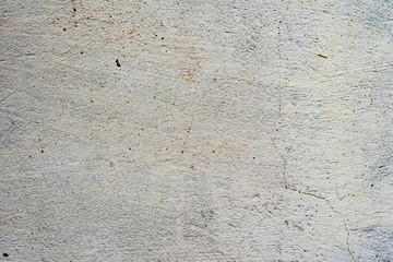 Texture of a concrete wall with cracks and scratches which can be used as a background