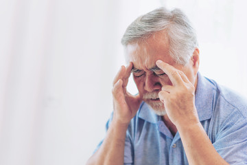 Elderly patients in bed, Asian senior man patients headache hands on forehead - medical and...
