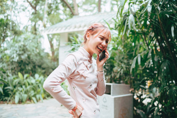 A Chinese woman is using cell phone
