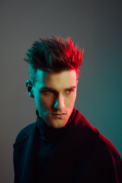 Close up of young man in studio.