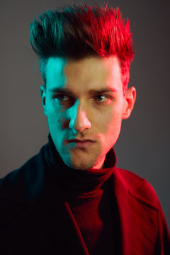 Close up of young man in studio.