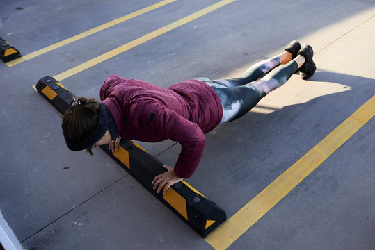 Pushups in parking lot.