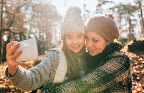 Mother and daughter outdoors