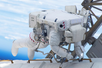 Tied astronaut in outer space on a space station. Elements of this image were furnished by NASA