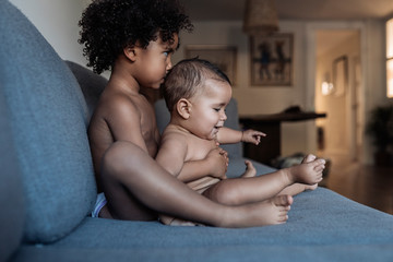 Portrait of beautiful siblings playing at home