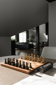 Chessboard on table in sunlight
