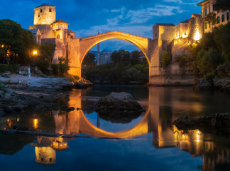 Old bridge and panorama of Mostar by night