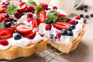 Tasty berry pie on grey background, closeup