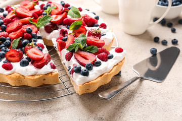 Tasty berry pie on grey background